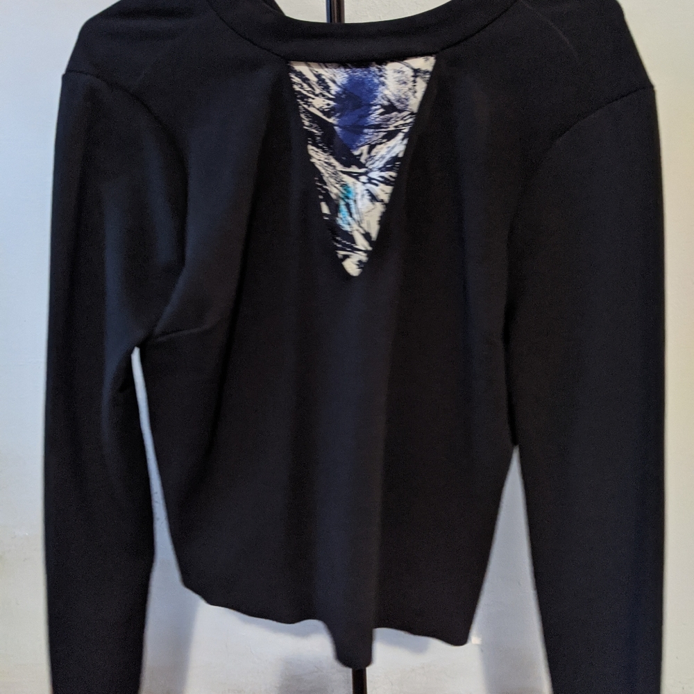 Black V-neck shirt with bow tie in front